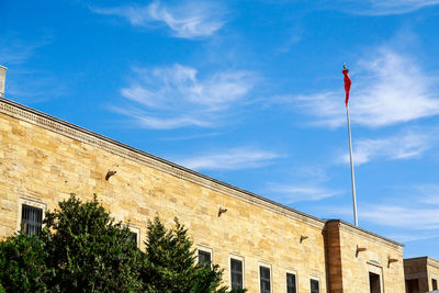 Low angle view of building against blue sky