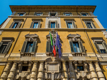 Low angle view of building against blue sky