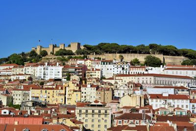 Houses in town against clear blue sky. downtown, lisbon, portugal 