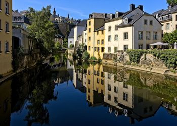 Reflection of buildings and trees in canal