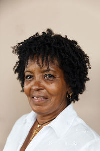 Close-up portrait of a smiling mid adult woman