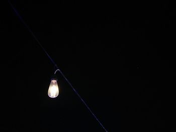 Low angle view of illuminated light bulb