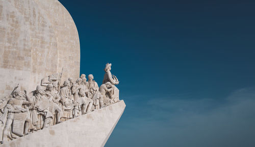 Low angle view of statue against sky