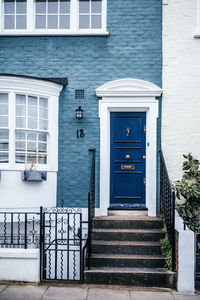 Classic blue door on painted brick london home