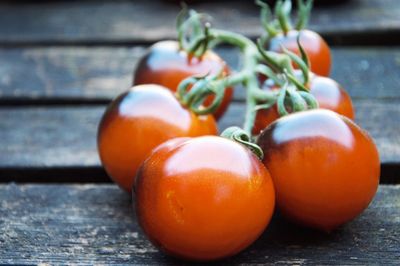 Close-up of tomatoes on wooden table