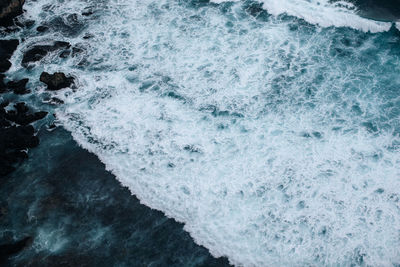 Amazing view of the indian ocean with white foam and strong waves. beauty of nature. top view