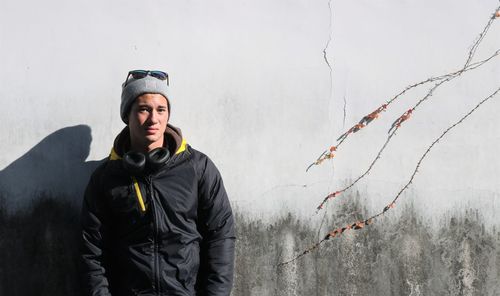 Portrait of man standing against sky