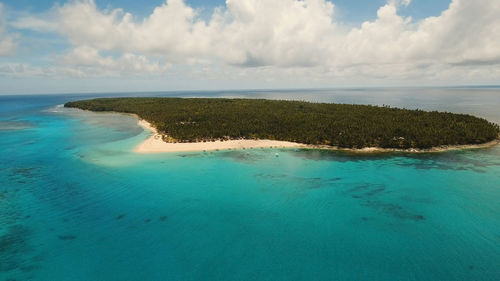 Aerial view of beautiful tropical island daco with white sand beach. 