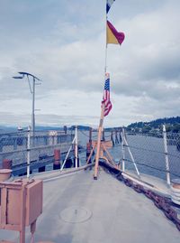 Flag on sea against sky