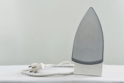 Close-up of computer on table against white background