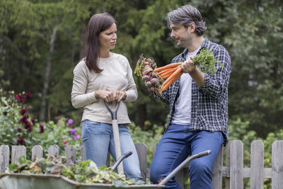 Woman holding food on plant