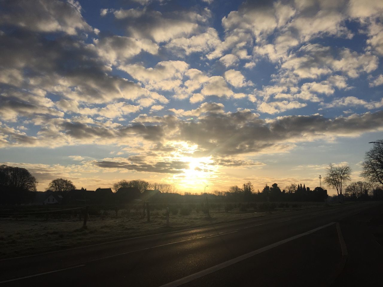 SCENIC VIEW OF ROAD AGAINST SKY DURING SUNSET