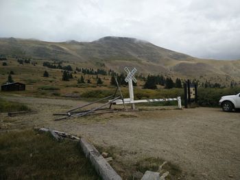 Scenic view of mountains against cloudy sky