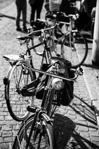 High angle view of bicycles parked on street during sunny day