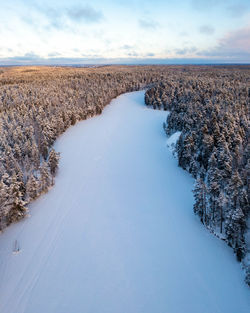 Frozen lake kaitalampi during winter from drone perspective, luukki espoo, vihti, finland