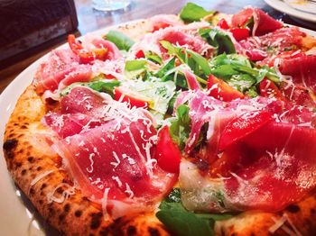 Close-up of pizza served on table