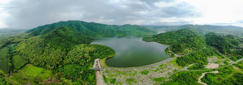 Panoramic view of green landscape against sky