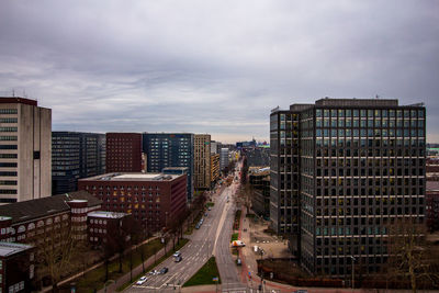 High angle view of buildings in city against sky