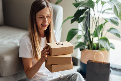 Young woman holding box