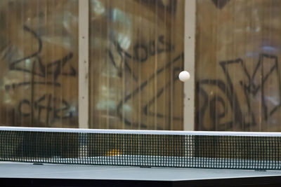 Ball in mid-air above table tennis table