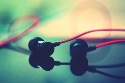 Close-up of earphones on table