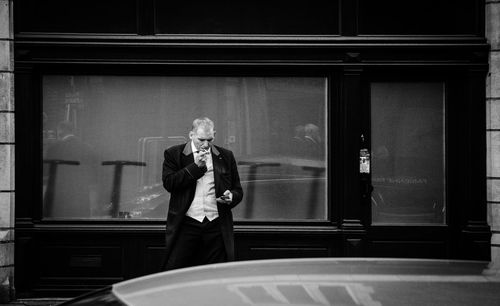 Man standing by window