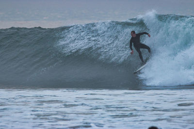 Man surfing in sea