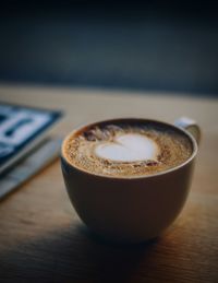 Close-up of cappuccino on table