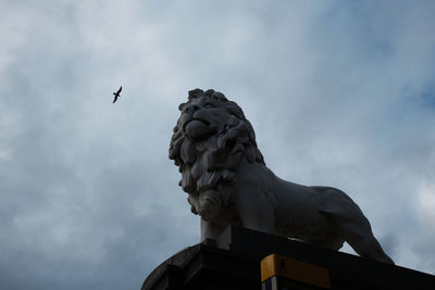 Low angle view of statue against sky