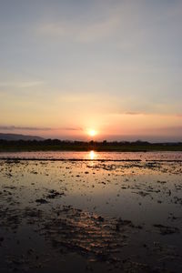 Scenic view of sea against sky during sunset