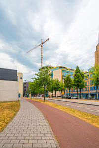 Street amidst buildings in city against sky