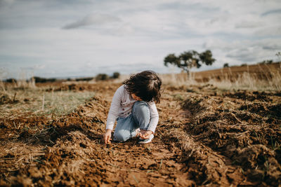 Child playing with mud