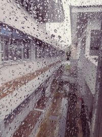 Full frame shot of wet glass window in rainy season