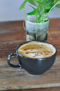 Close-up of coffee cup on table