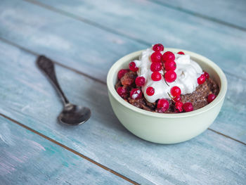 High angle view of strawberries in bowl on table