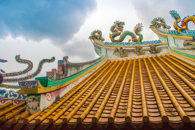 Low angle view of statue against sky