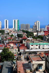 Aerial view of buildings in vedado neighborhood in havana city against a clear blue sky