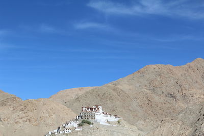 Low angle view of old ruin on mountain against sky