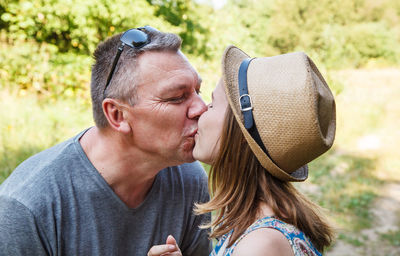 Close-up of couple kissing outdoors