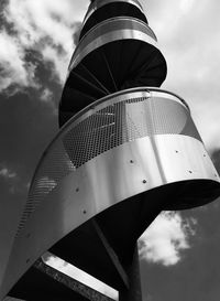 Low angle view of building against cloudy sky