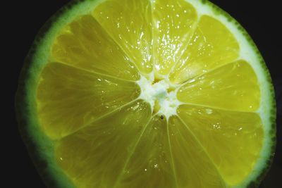 Extreme close up of lemon slice on table