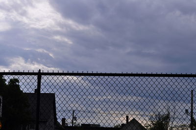 Low angle view of building against cloudy sky