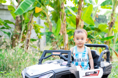 Portrait of boy and plants