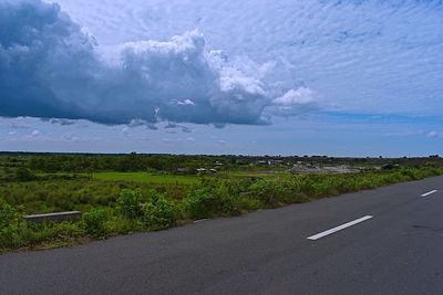 Road by land against sky