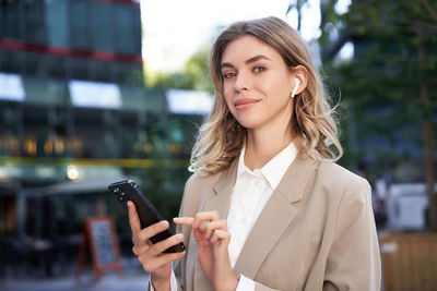 Young businesswoman using mobile phone