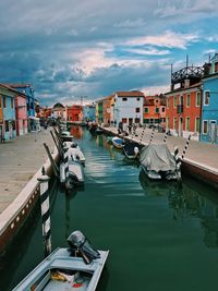 Boats moored at harbor