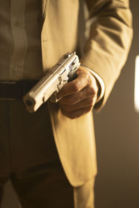 Midsection of man using phone