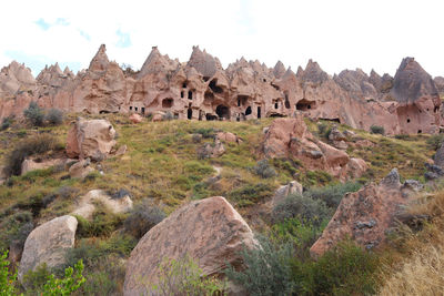 The ancient cave houses and fairy chimneys in valley of cappadocia, turkey. tourist destination.