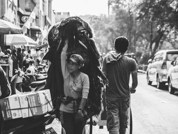 People standing on street in city