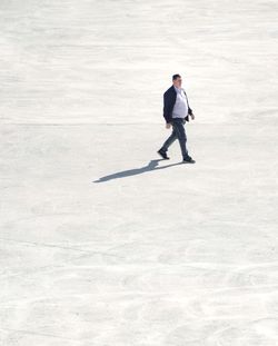 Full length of man walking on floor